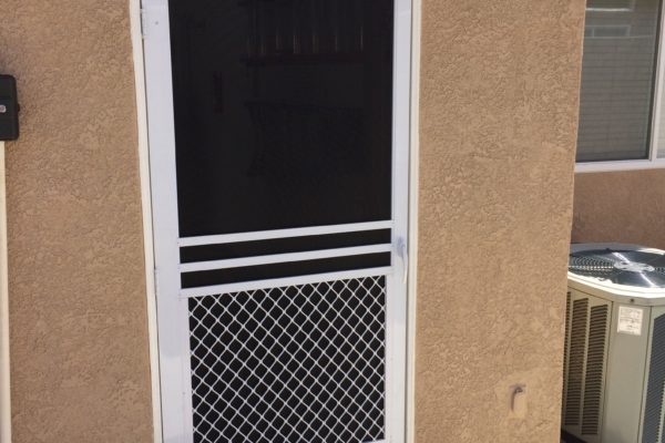 White "safeguard " swinging screen door installed in Menifee 4/2/15