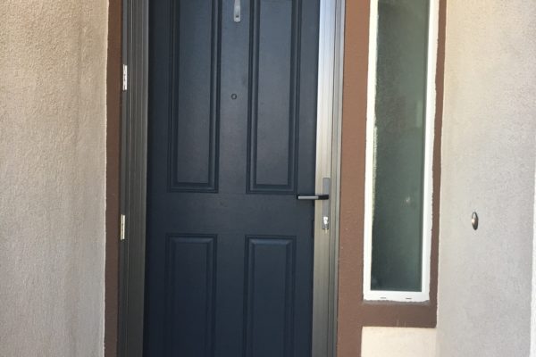 3'x8' bronze Guarda premium security screen door installed 1/6 in Summerly Homes in Lake Elsinore - 1